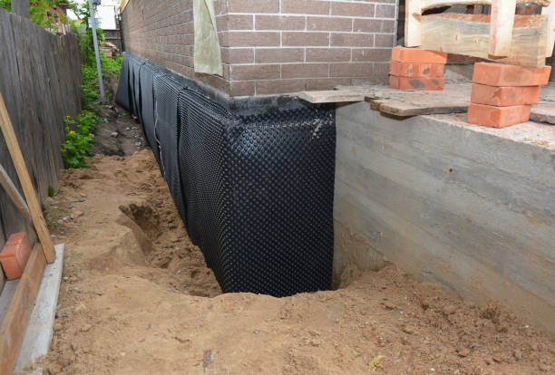 Happy homeowners after waterproofing job in Fishers
